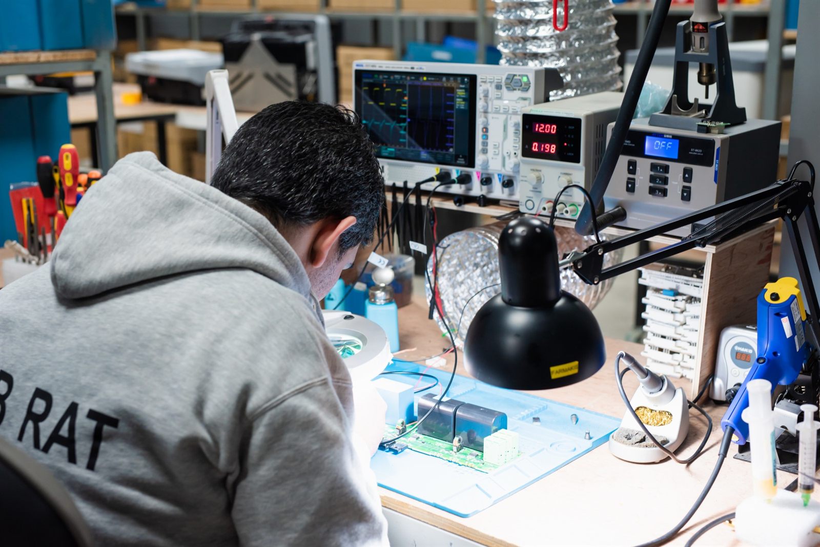 Workbench with oscilloscope, power supply and hot-air station